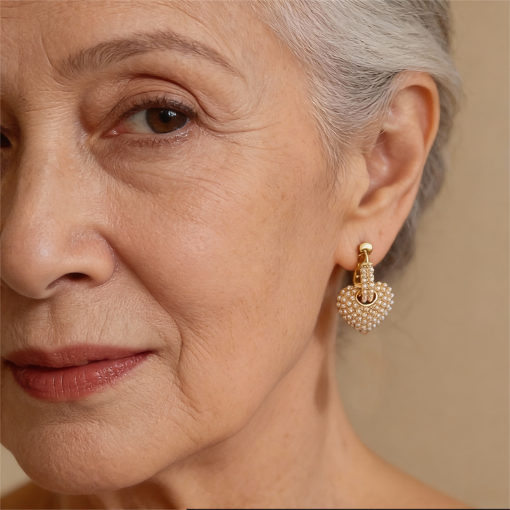 Złote kolczyki z perłami miłości